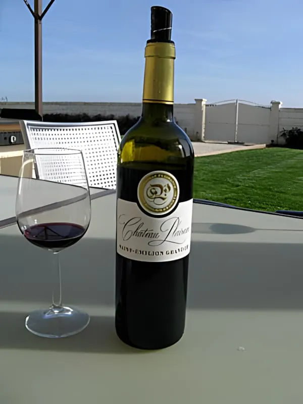 Château Plaisance Saint-Émilion Grand Cru wine bottle and glass